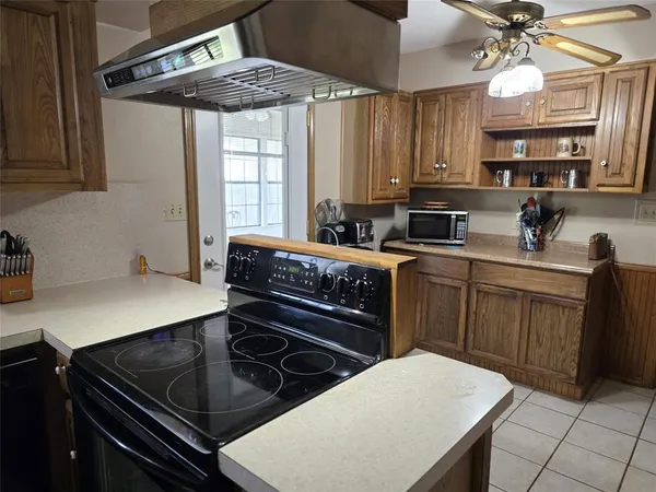 a kitchen with stainless steel appliances a sink and cabinets