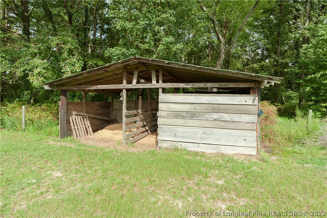 3726 Hayfield Road Wade, NC 28395 - Photo 40 of 50 a view of house with backyard