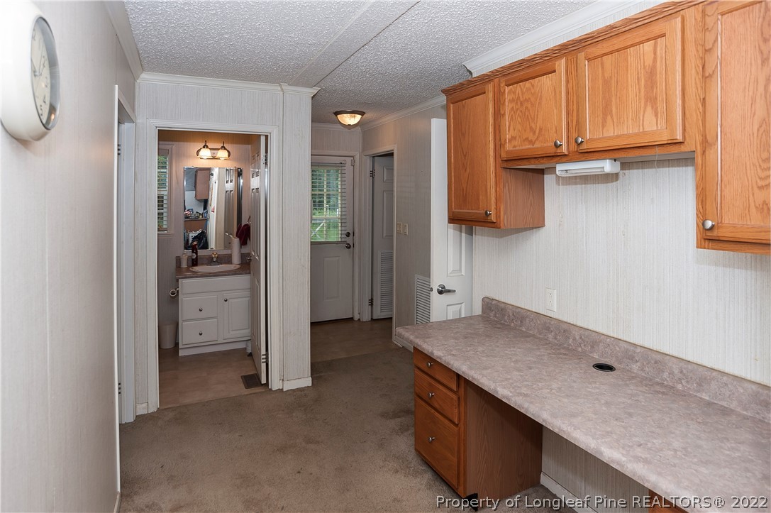 3726 Hayfield Road Wade, NC 28395 - Photo 8 of 50 a kitchen with stainless steel appliances granite countertop a refrigerator and a sink