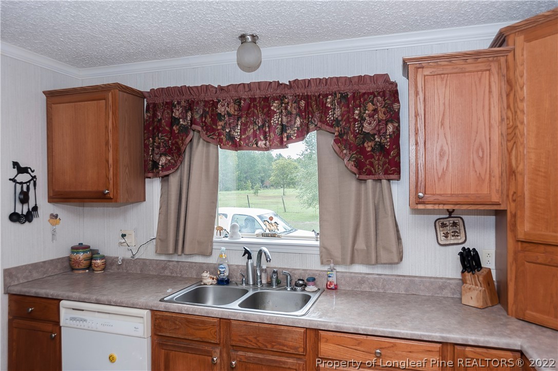 3726 Hayfield Road Wade, NC 28395 - Photo 10 of 50 a kitchen with a sink and a window