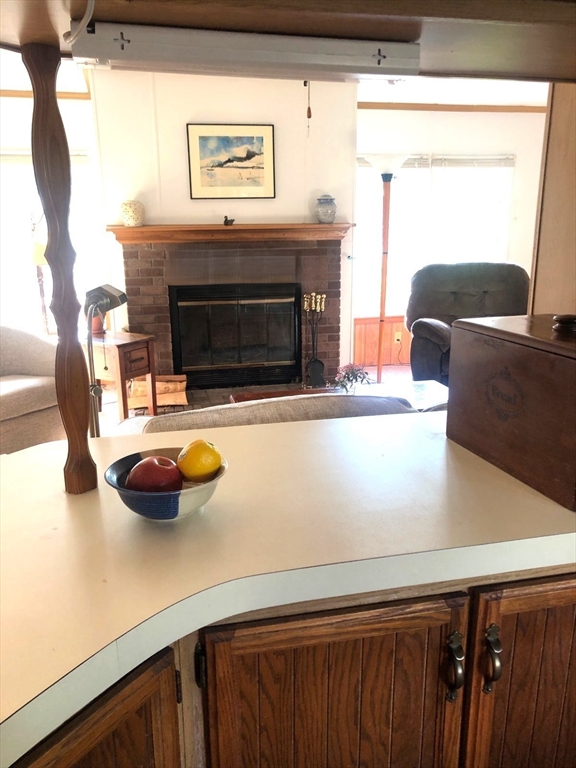 41 Pipers Way Carver, MA 02330 - Photo 12 of 36 a kitchen with a sink and a stove with a wooden floor