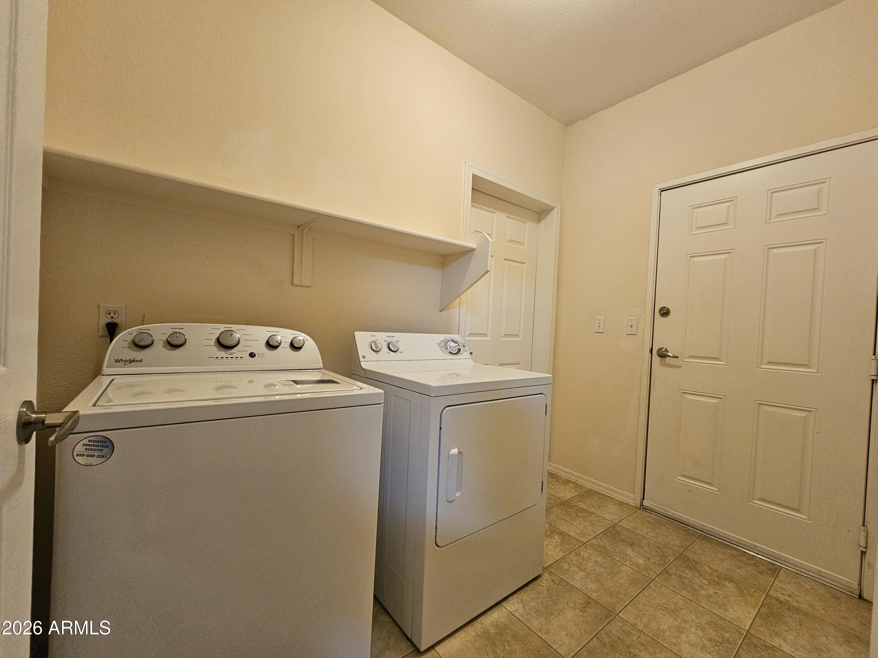 18416 North Cave Creek Road, Unit 1041 Phoenix, AZ 85032 - Photo 9 of 13 a utility room with dryer and washer