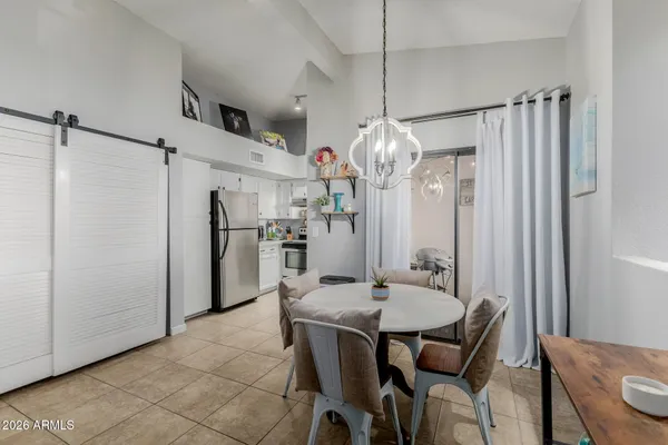 a kitchen with white cabinets a sink stove and white stainless steel appliances