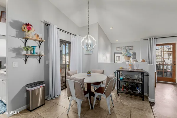 a kitchen with stainless steel appliances granite countertop a refrigerator sink and stove