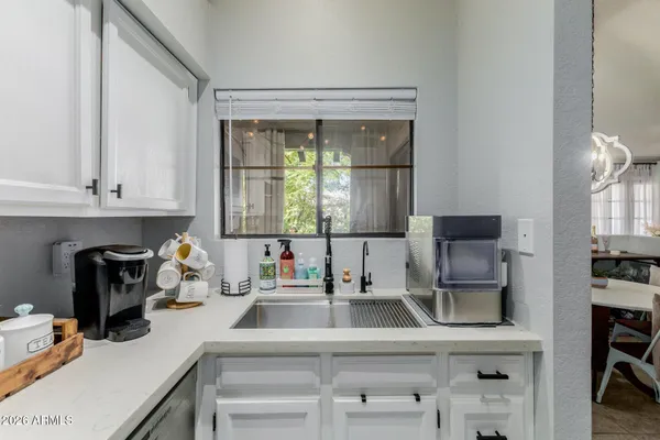 a bedroom with furniture and a flat screen tv