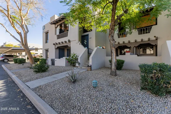 a view of a house with a street
