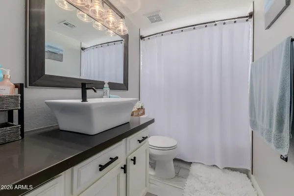 a view of a hallway with furniture and front door