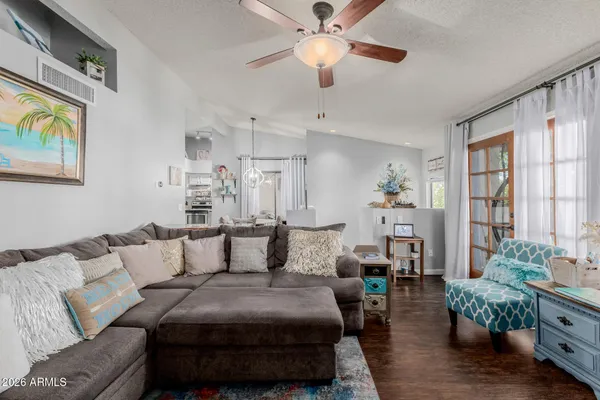 a living room with furniture and a flat screen tv