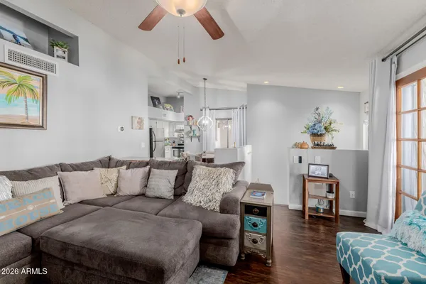 a kitchen with stainless steel appliances a table and chairs