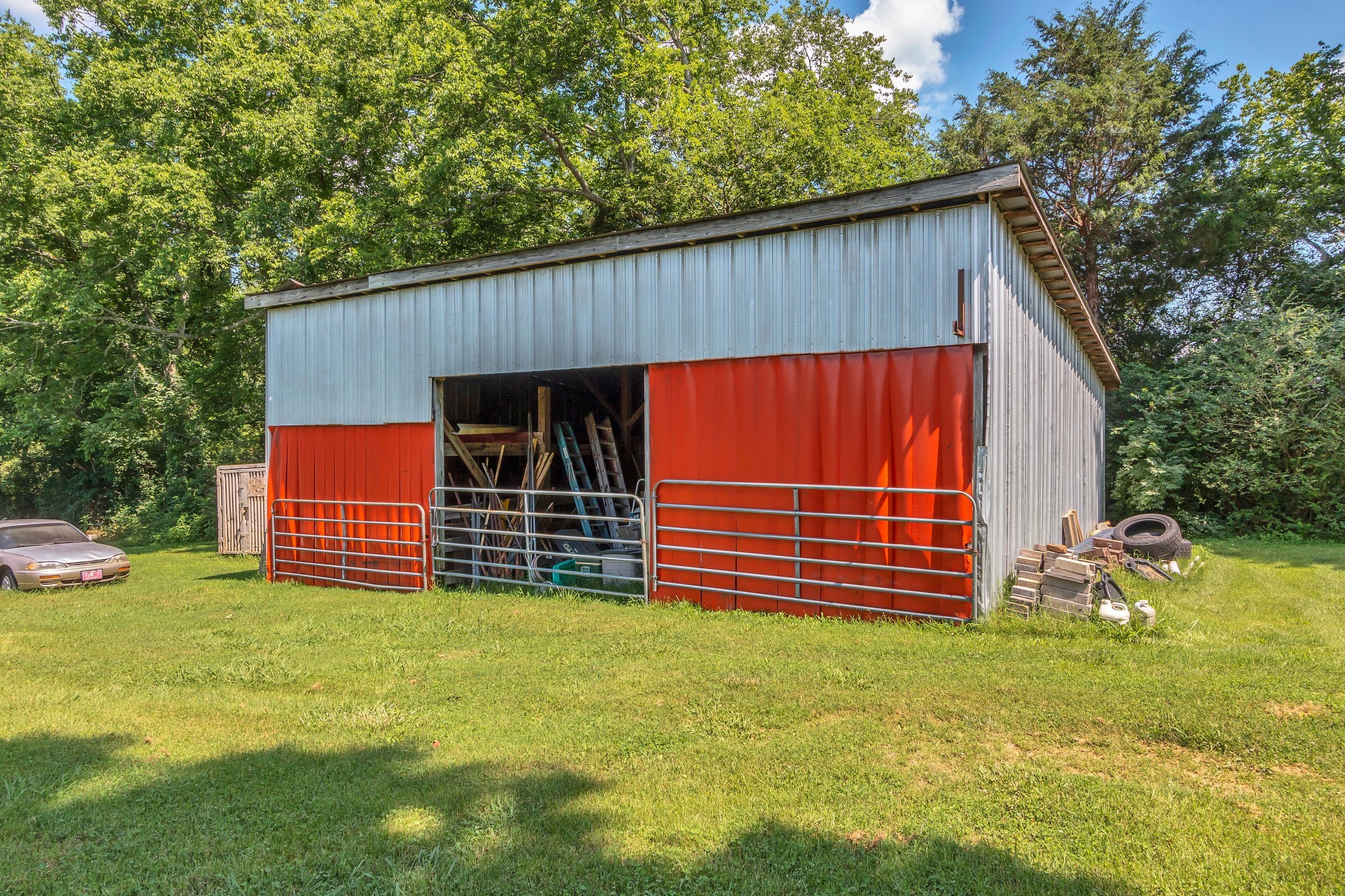 3349 Sweeney Hollow Road Franklin, TN 37064 - Photo 20 of 41 a view of a house with a backyard and a chair under the roof