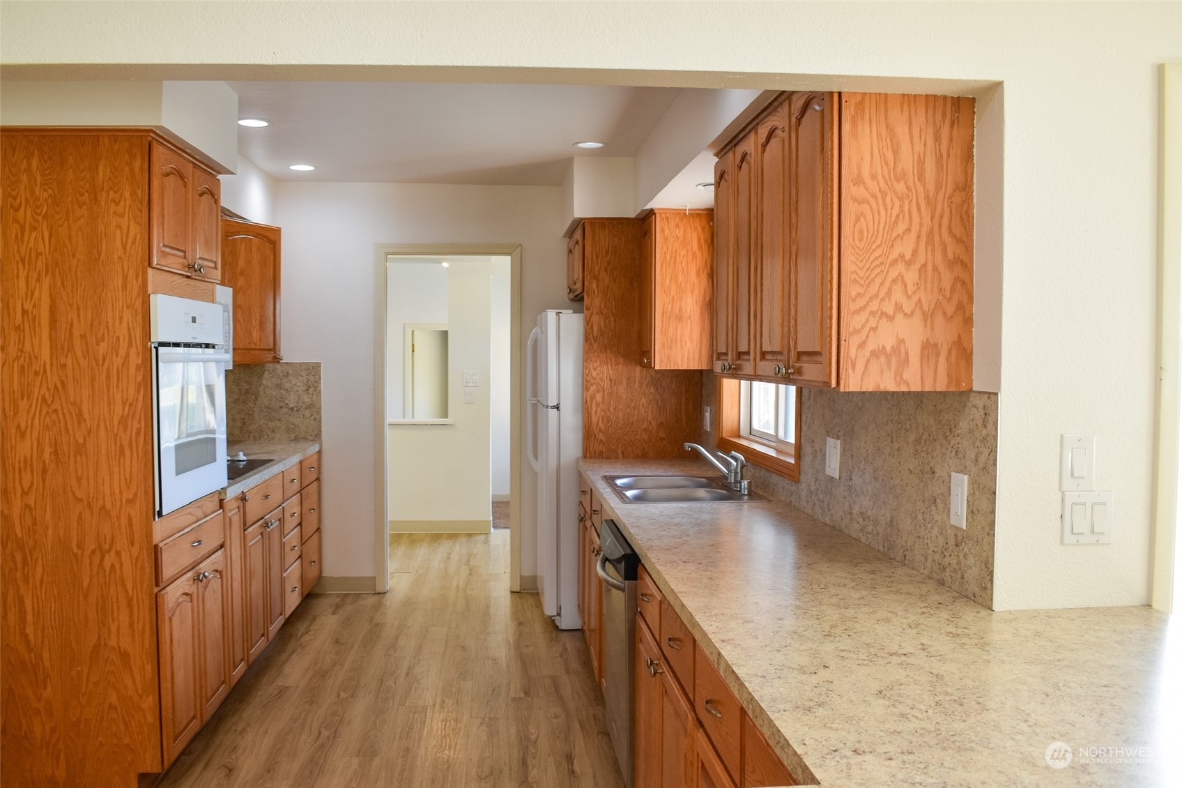 2287 Slater Road Ferndale, WA 98248 - Photo 6 of 19 a kitchen with kitchen island granite countertop wooden cabinets a sink and a stove