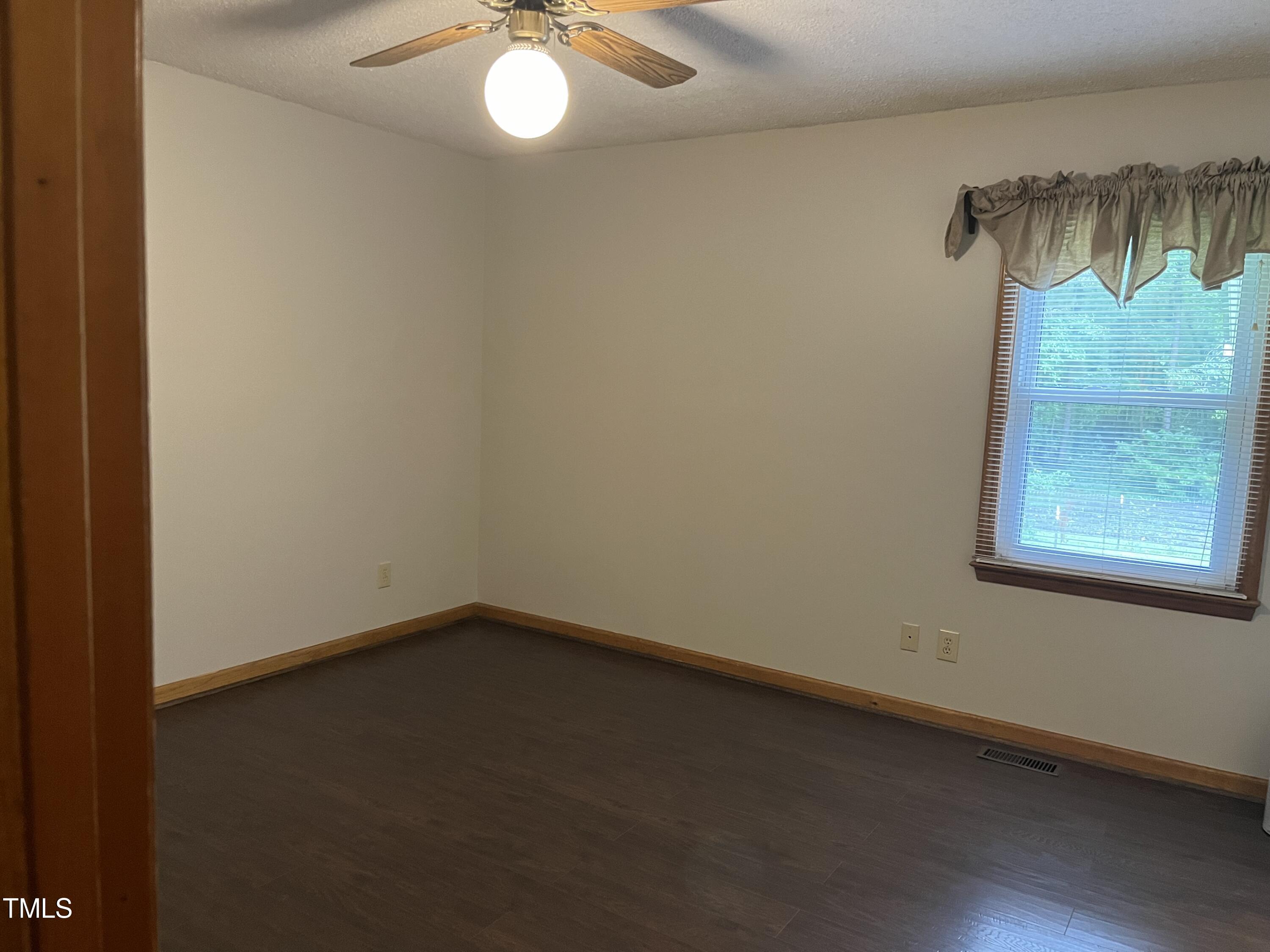 3143 Hester Road Creedmoor, NC 27522 - Photo 7 of 21 wooden floor in an empty room