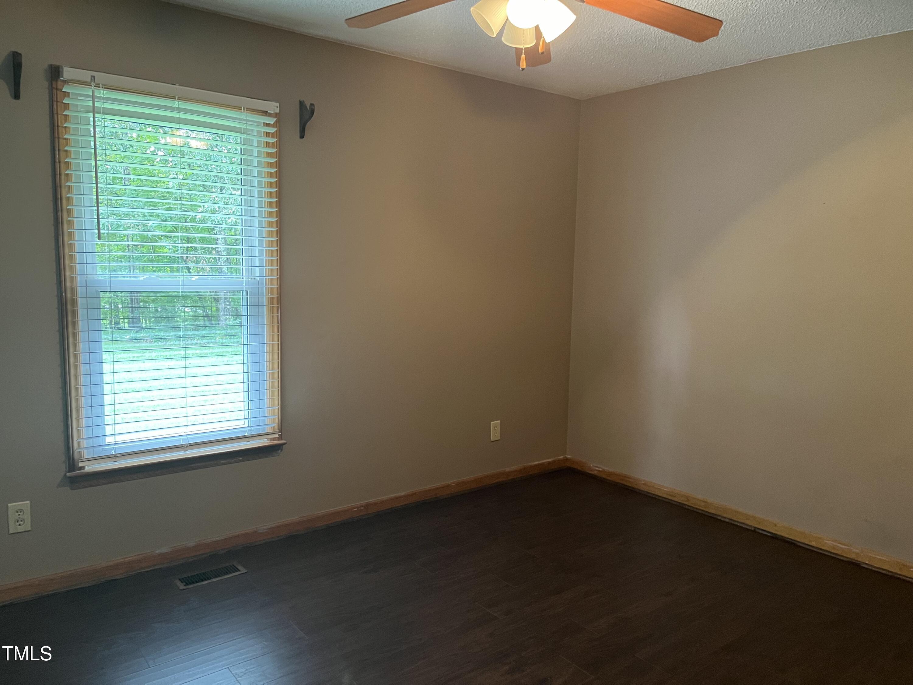 3143 Hester Road Creedmoor, NC 27522 - Photo 8 of 21 an empty room with a window