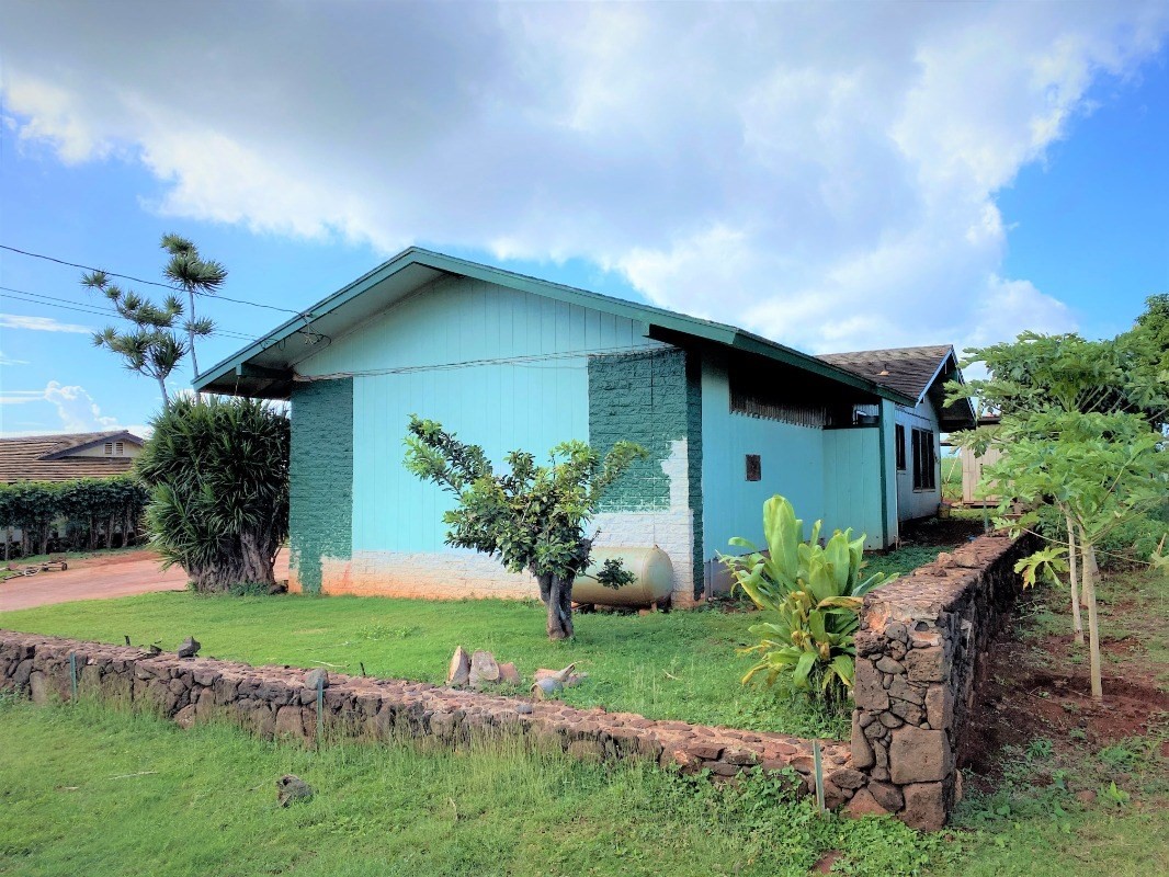 4825 Moi Road Hanapepe, HI 96716 - Photo 4 of 14 a front view of a house with garden