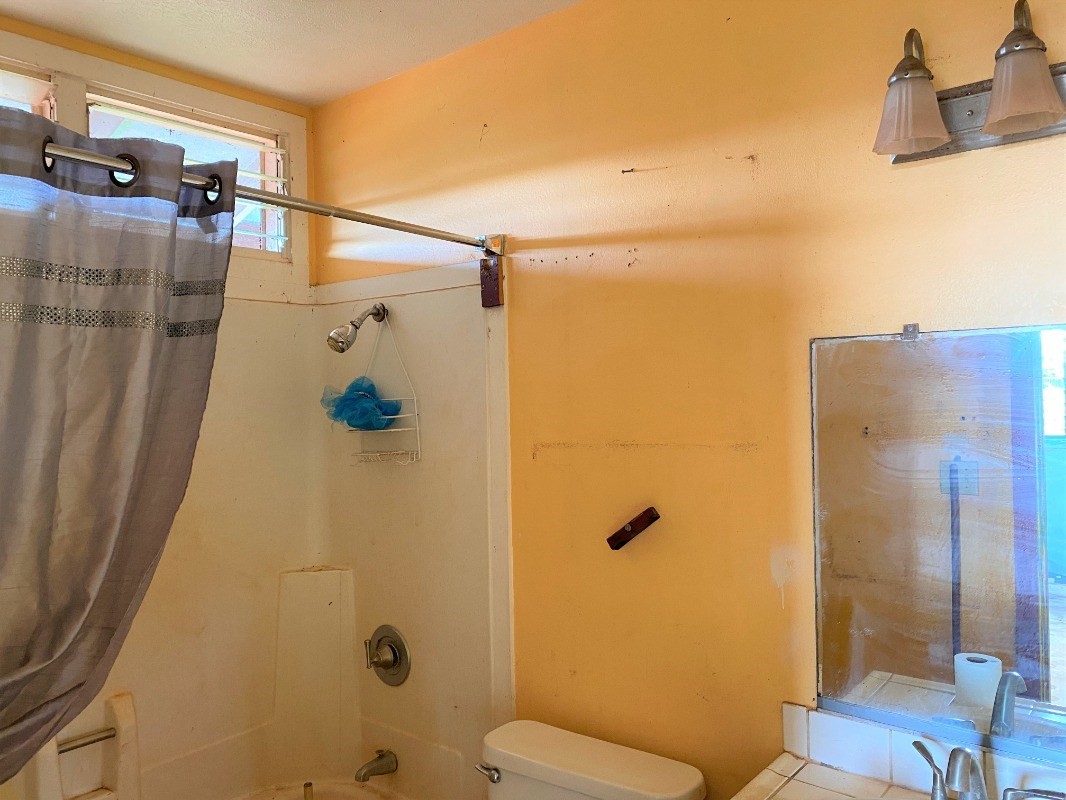 4825 Moi Road Hanapepe, HI 96716 - Photo 10 of 14 a bathroom with a shower and toilet
