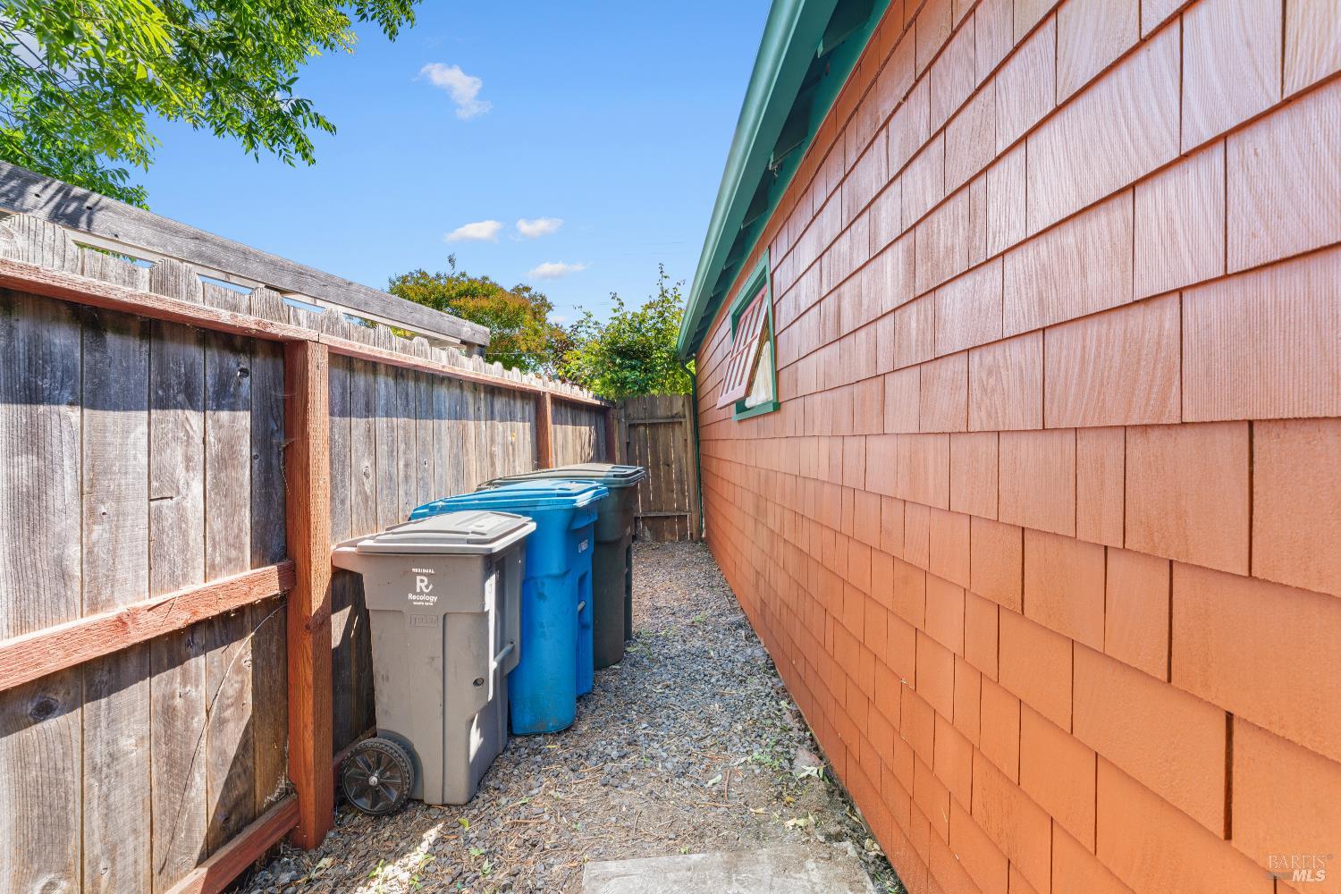 309 Hendley Street Santa Rosa, CA 95404 - Photo 30 of 31 a view of a backyard with brick wall and wooden fence