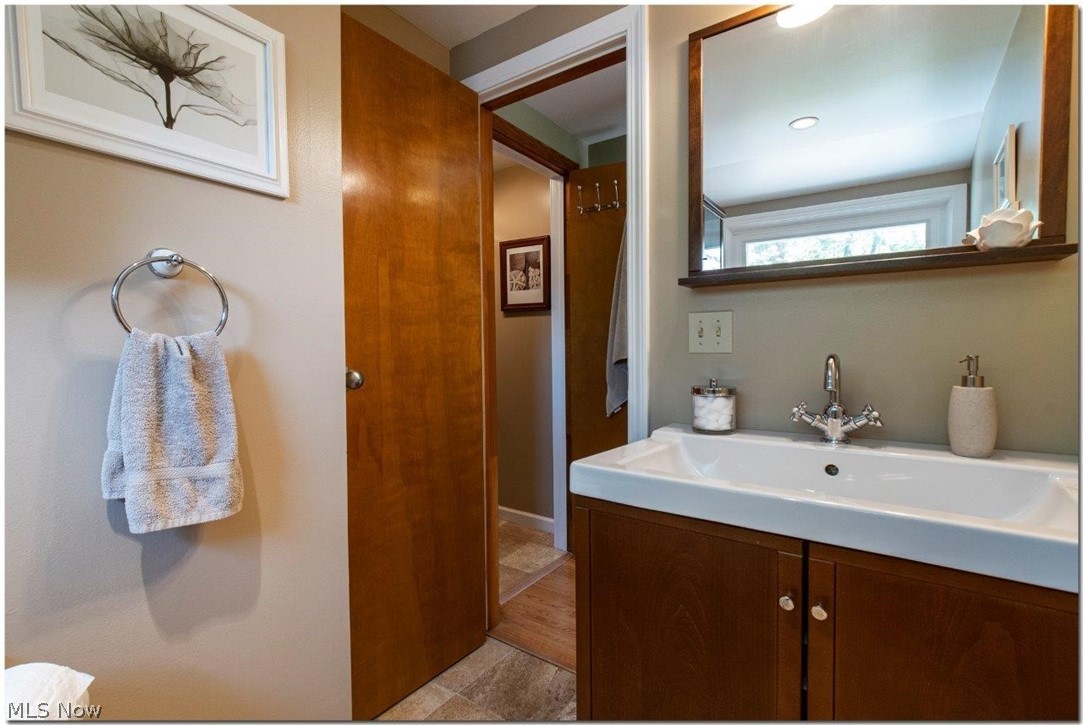 4660 Liberty Road South Euclid, OH 44121 - Photo 23 of 35 Updated Full Bathroom #2
with Separate Room with Glass Enclosed Shower with Porcelain Tiles
and Stone Mosaic Accents
