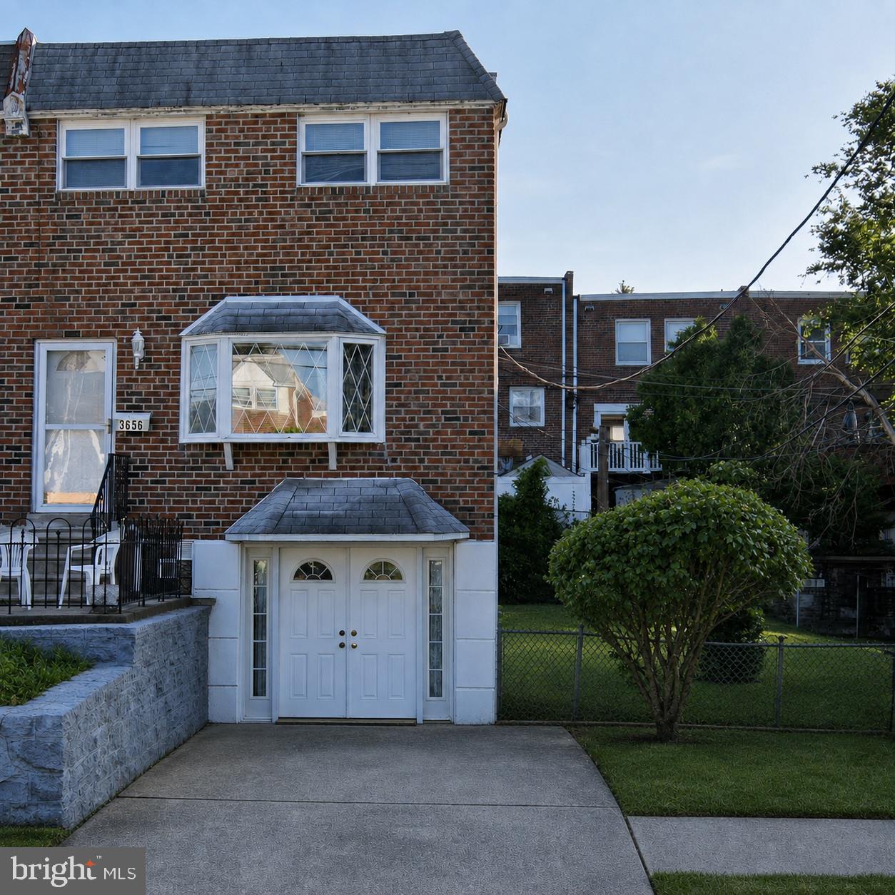 3655 Academy Road Philadelphia, PA 19154 - Photo 1 of 1 Charming brick home with lush greenery.