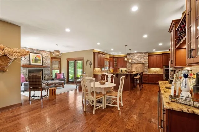 a living room with lots of furniture and wooden floors