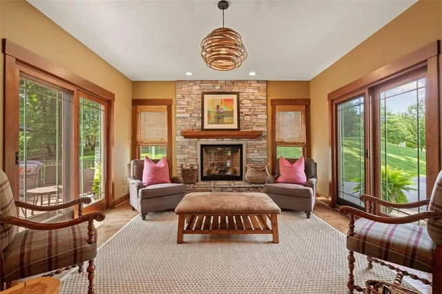 a bedroom with furniture and a large window