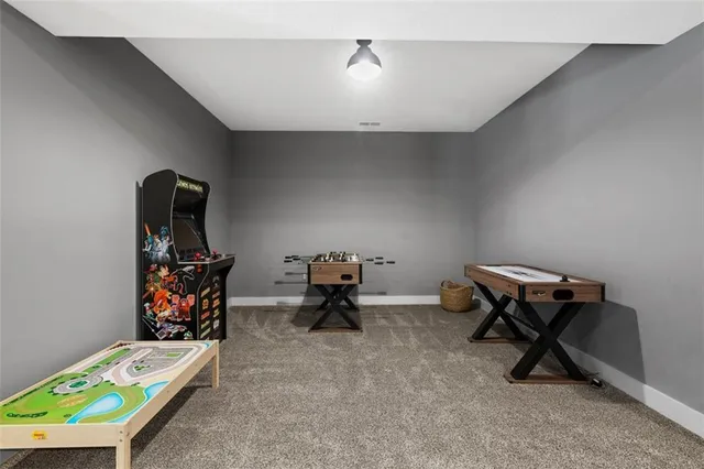 a bedroom with furniture and a lamp