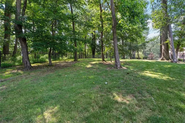 a view of outdoor space with trees all around