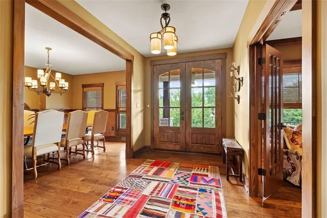 a bedroom with furniture and a rug