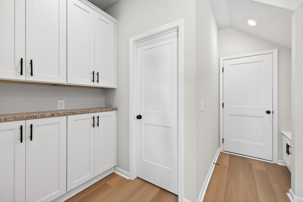 578 Madison Street, Unit 100 Commerce, GA 30529 - Photo 11 of 37 a view of room with hardwood floor