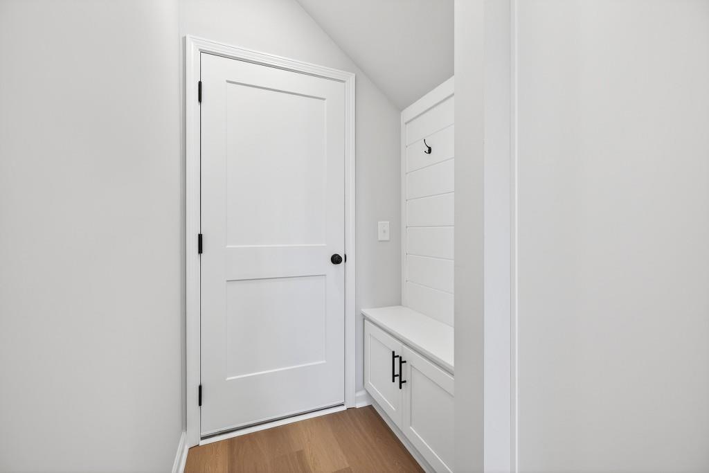 578 Madison Street, Unit 100 Commerce, GA 30529 - Photo 13 of 37 a view of walk in closet with empty racks