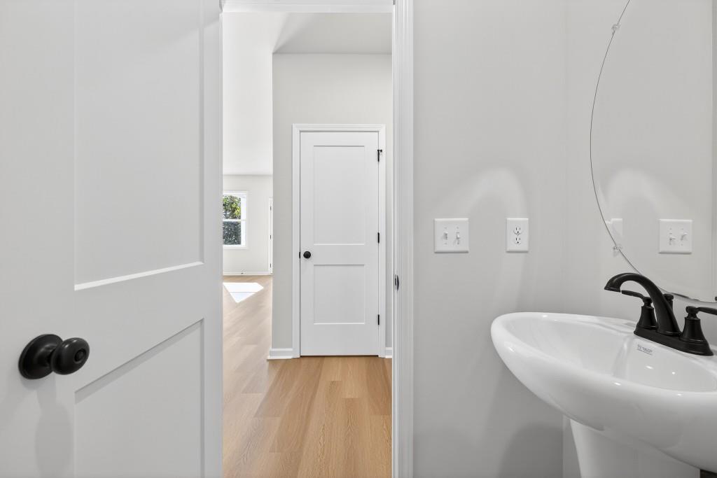 578 Madison Street, Unit 100 Commerce, GA 30529 - Photo 15 of 37 a bathroom with a sink and a mirror