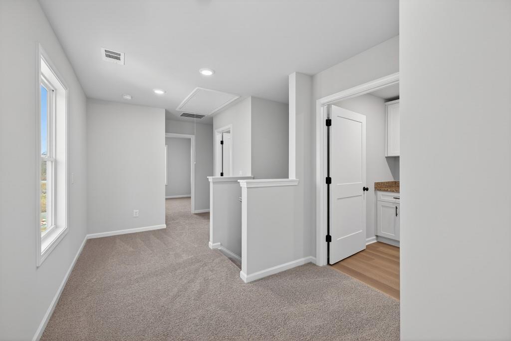 578 Madison Street, Unit 100 Commerce, GA 30529 - Photo 17 of 37 an empty room with closet and a bathroom