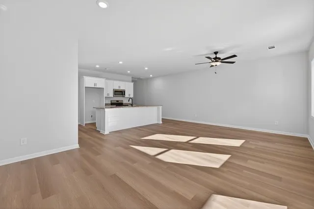 a view of a kitchen with a sink and cabinets