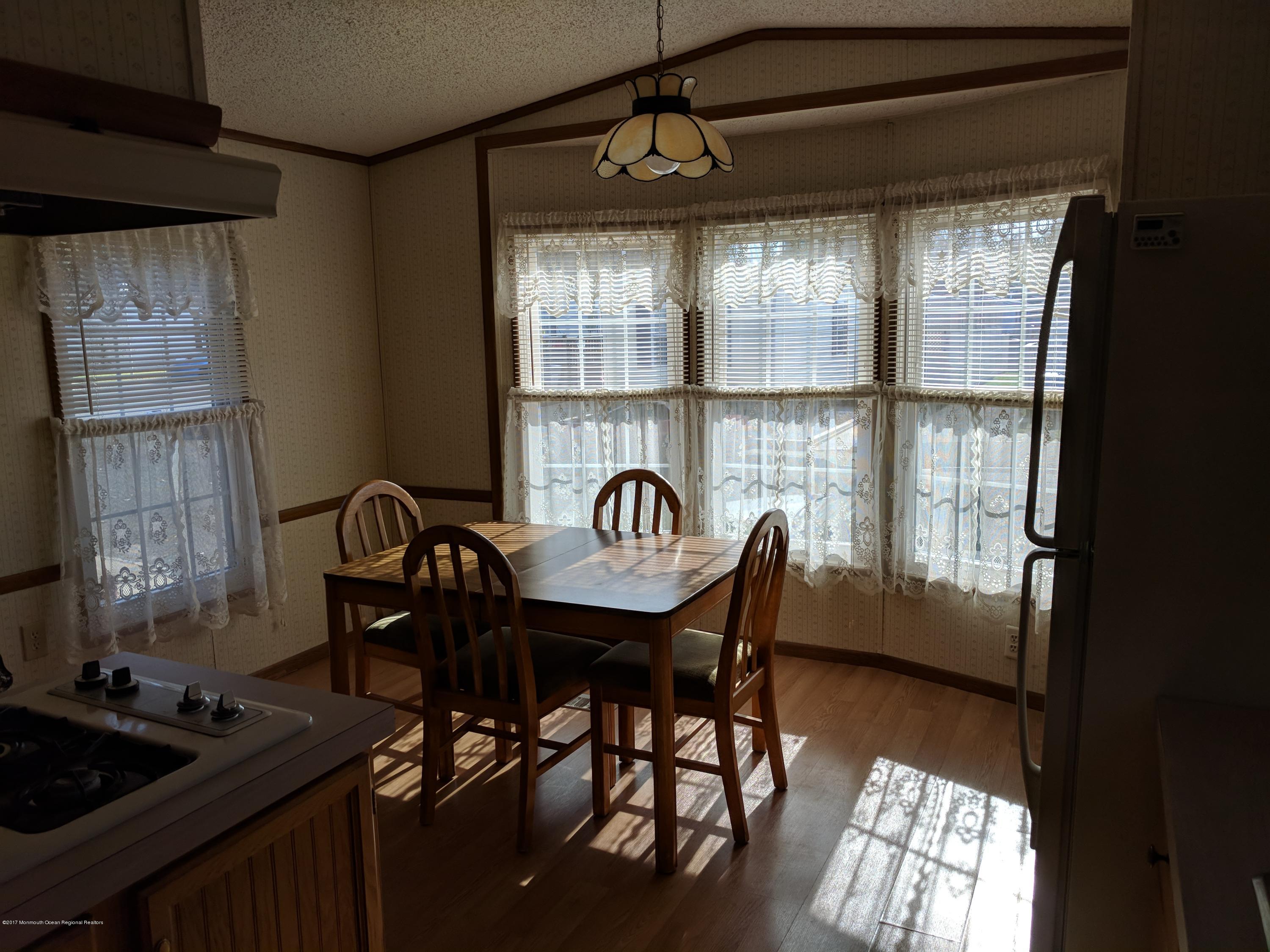 42 Ruffian Way Howell, NJ 07731 - Photo 5 of 7 a view of a dining room with furniture and window