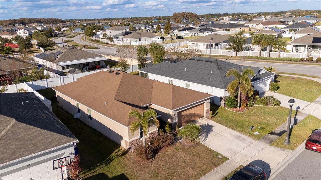 4563 Orchard Grove Road St. Cloud, FL 34772 - Photo 3 of 51 an aerial view of a tennis ground and a big yard
