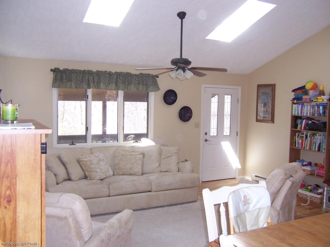 104 Riverside Lane Pocono Lake, PA 18347 - Photo 5 of 10 living room 2