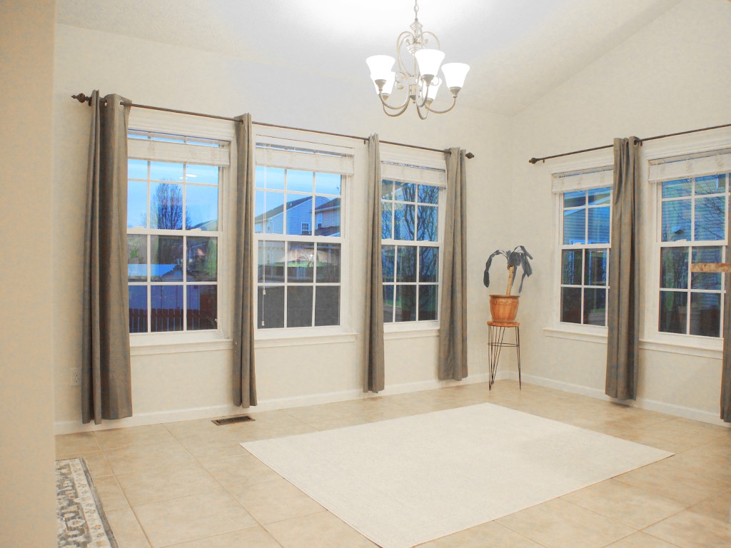 1978 Spring Ridge Drive Xenia, OH 45385 - Photo 13 of 44 This bright room features vaulted ceilings and ample natural light, creating an inviting atmosphere.