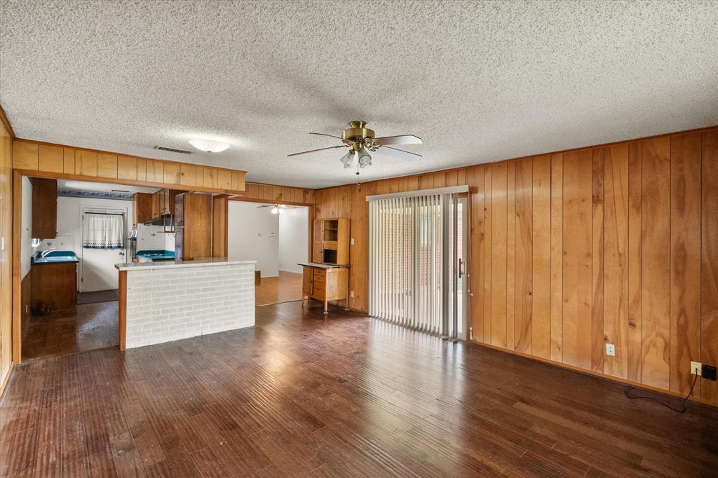 613 Whitener Road Euless, TX 76040 - Photo 8 of 29 Living room open to kitchen and dining room