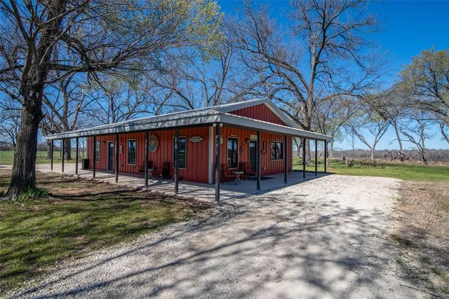 a bedroom with bed and window