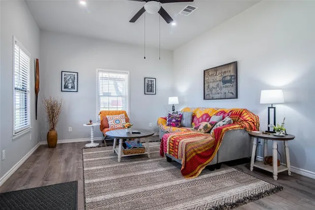 a bedroom with furniture and a wooden floor