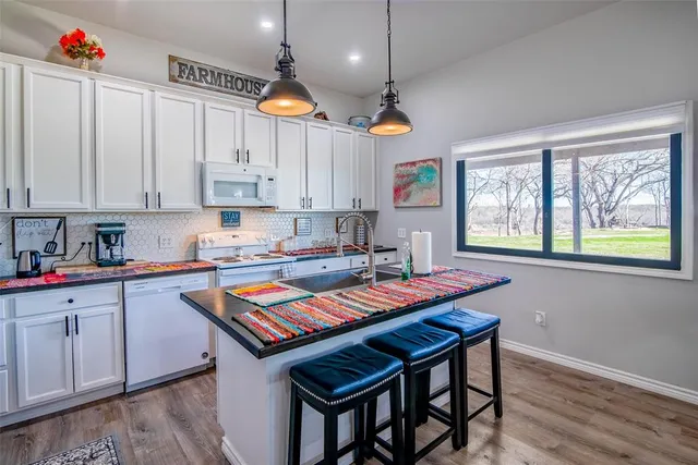 a bedroom with bed and mirror