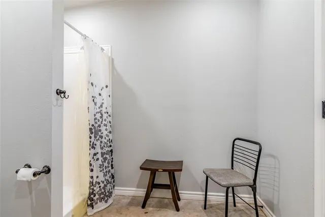 a view of a house with a yard and tree