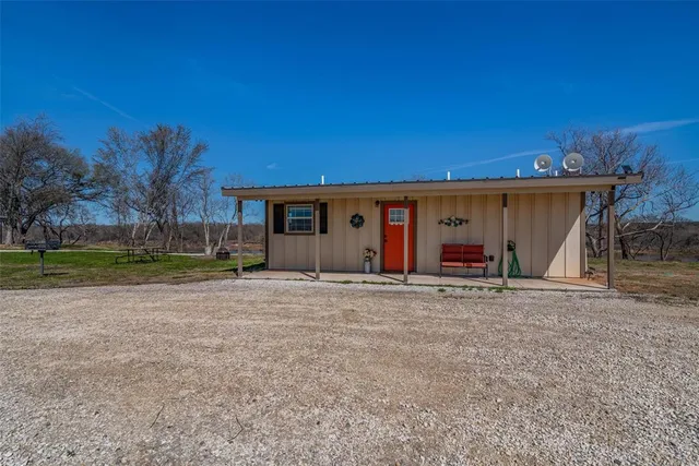 a kitchen with a refrigerator a stove a sink dishwasher and microwave with wooden floor