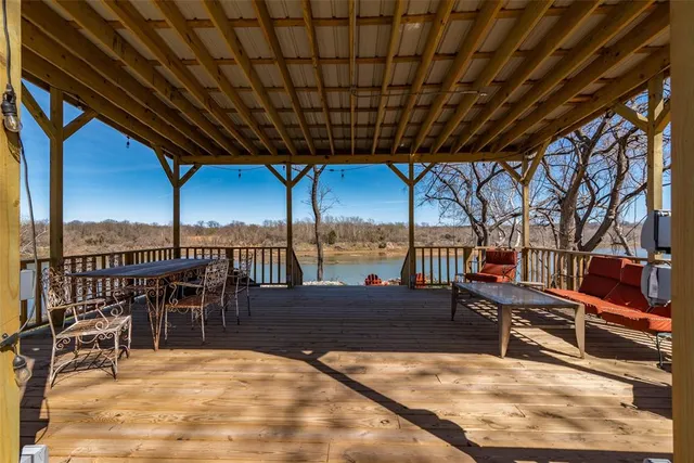 a backyard of a house with lots of green space and mountain view in a back