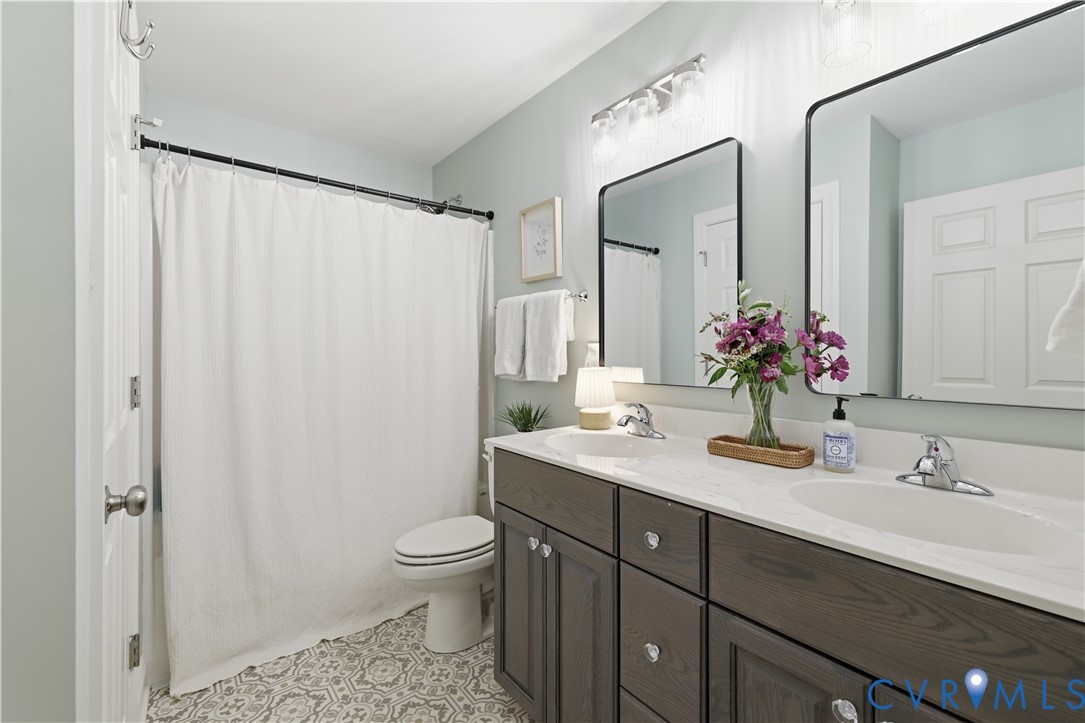 222 Oak Ridge Court Aylett, VA 23009 - Photo 24 of 35 Bathroom featuring a double vanity with white coun