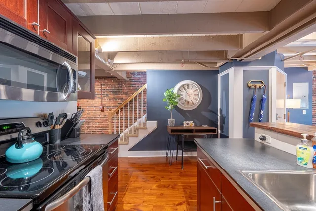 a kitchen with a stove and a table