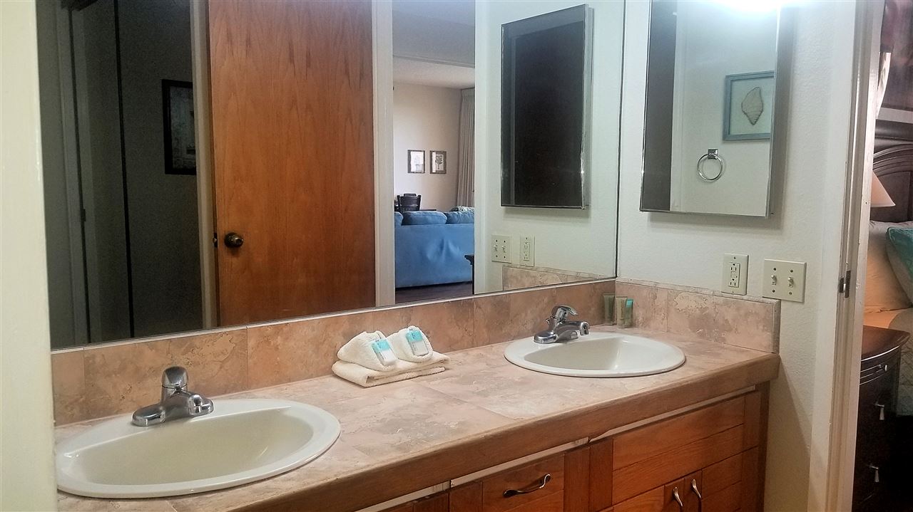 4299 Lower Honoapiilani Road, Unit 134 Lahaina, HI 96761 - Photo 14 of 29 a bathroom with a sink and a mirror