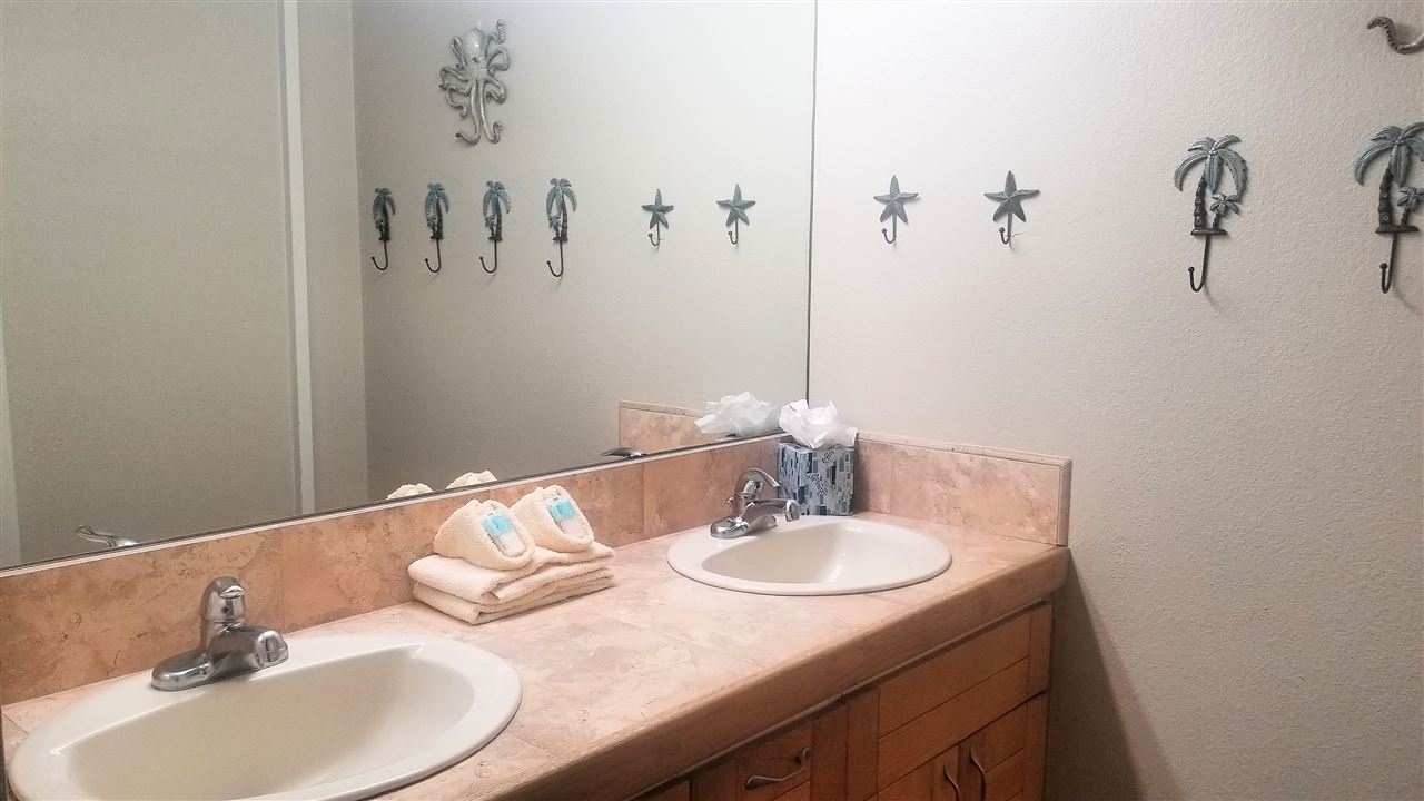 4299 Lower Honoapiilani Road, Unit 134 Lahaina, HI 96761 - Photo 19 of 29 a bathroom with a sink and a mirror