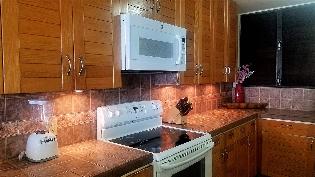 4299 Lower Honoapiilani Road, Unit 134 Lahaina, HI 96761 - Photo 6 of 29 a kitchen with a sink and cabinets