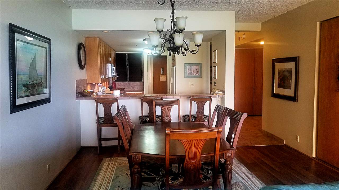 4299 Lower Honoapiilani Road, Unit 134 Lahaina, HI 96761 - Photo 7 of 29 a view of a a dining room with furniture window and wooden floor