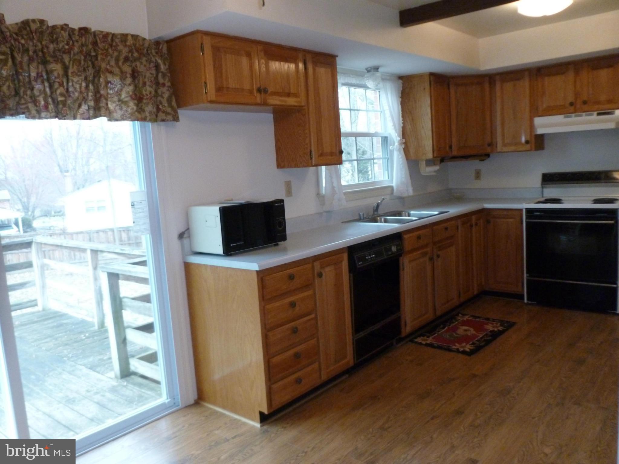 6905 Sydenstricker Road Springfield, VA 22152 - Photo 11 of 25 SGD off Kitchen to Deck and Yard